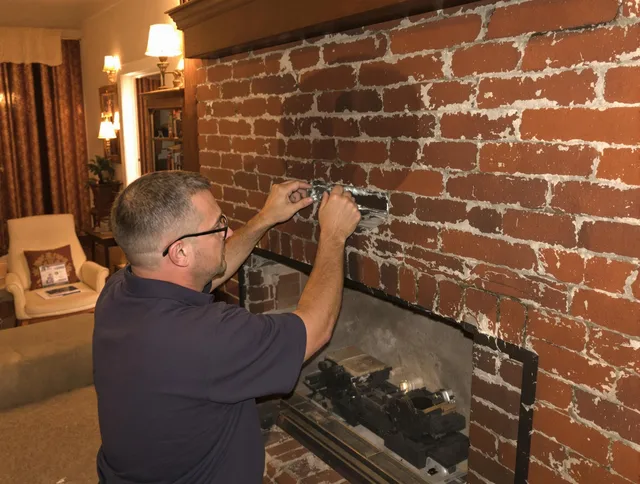 Concord Chimney Sweep expert fixing a fireplace in Concord, MA